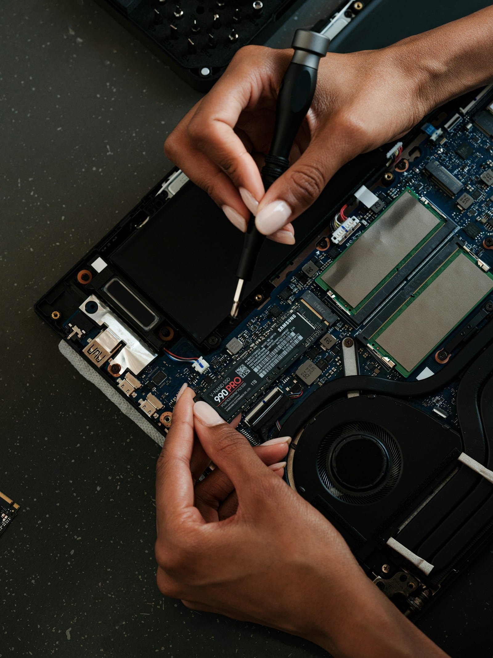 Laptop Repairability Scores 2026, A Practical Guide (iFixit Rankings, Modular vs Soldered, Upgrade Options) 9 Laptop repair workspace with screwdriver tools - Laptop Repairability Scores 2026