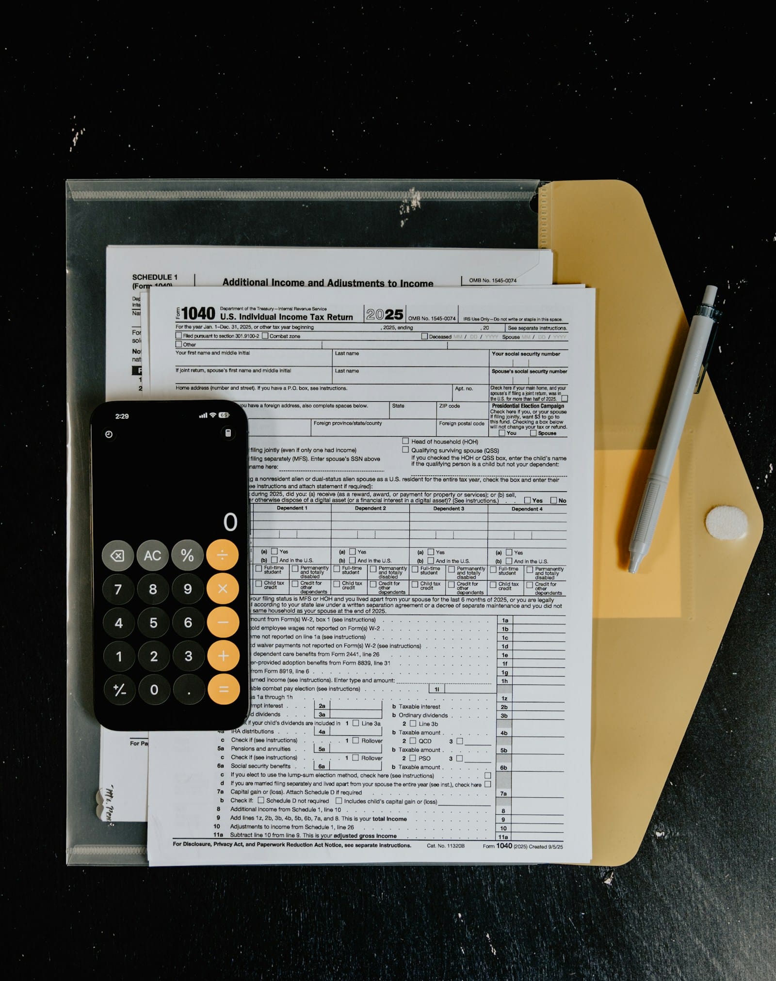 Quarterly Estimated Taxes for Freelancers calculator and tax forms on desk