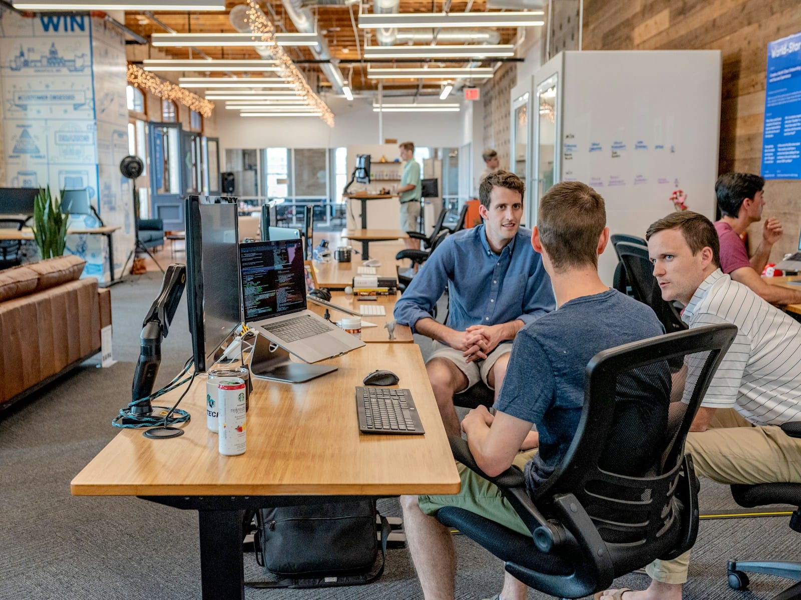 10 Best AI Cold Email Tools to Fill Your Sales Pipeline 9 Business team working on laptops for cold email outreach campaign