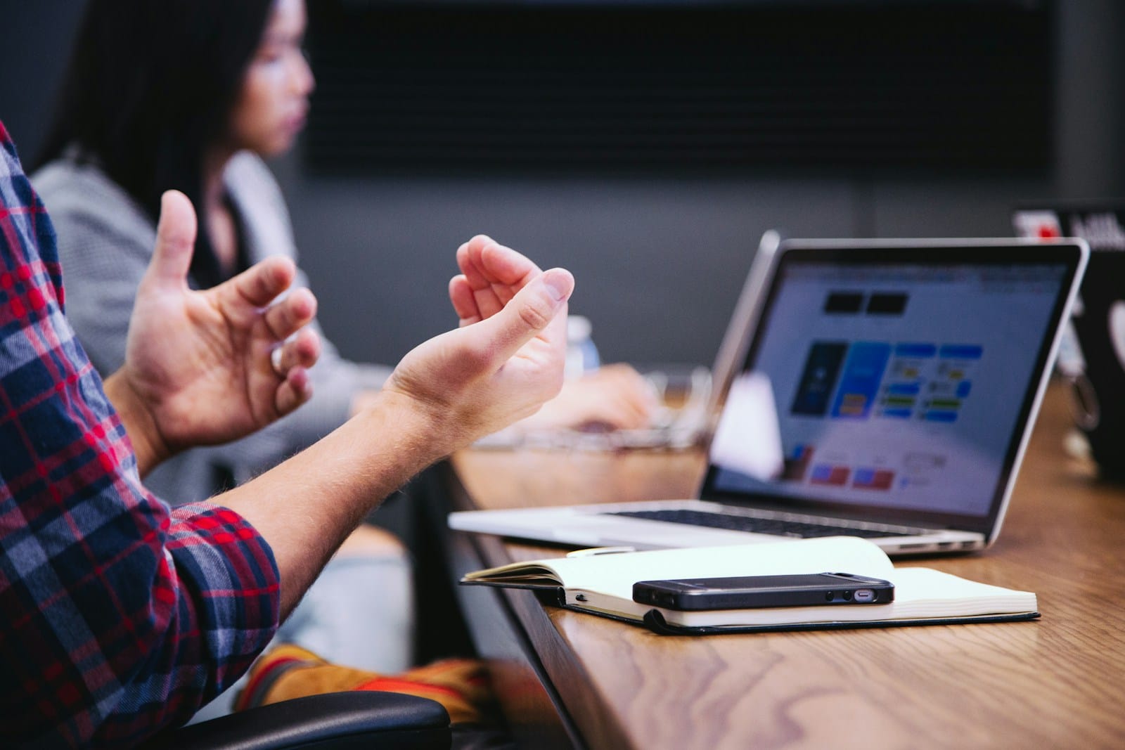 Team reviewing AI meeting notes tools in a modern conference room